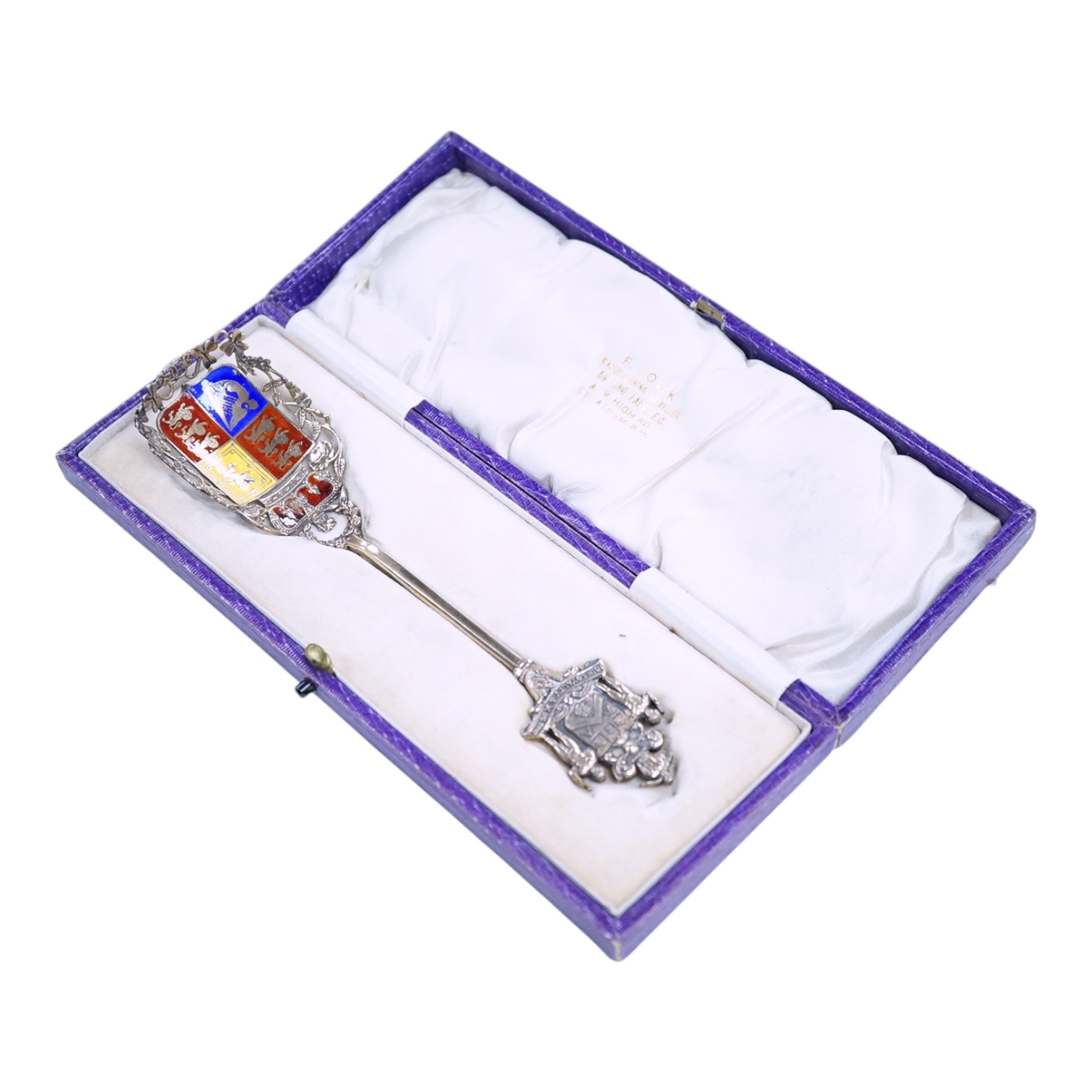 A cased silver gilt and polychrome enamelled spoon, the terminal modelled as the crest of the Worshipful Company of Joiners and Ceilers, to commemorate the Coronation of George V in 1911, Levi & Salaman, London, 1910, 17